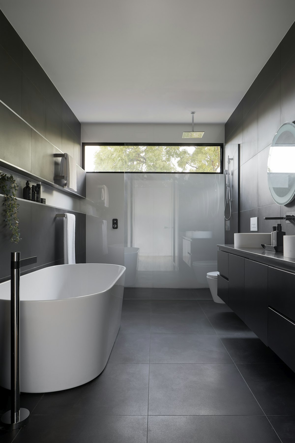 Finished bathroom with freestanding bath and walk-in shower