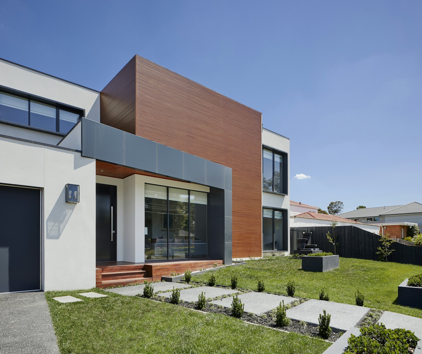 Modern rear extension with timber cladding and large windows