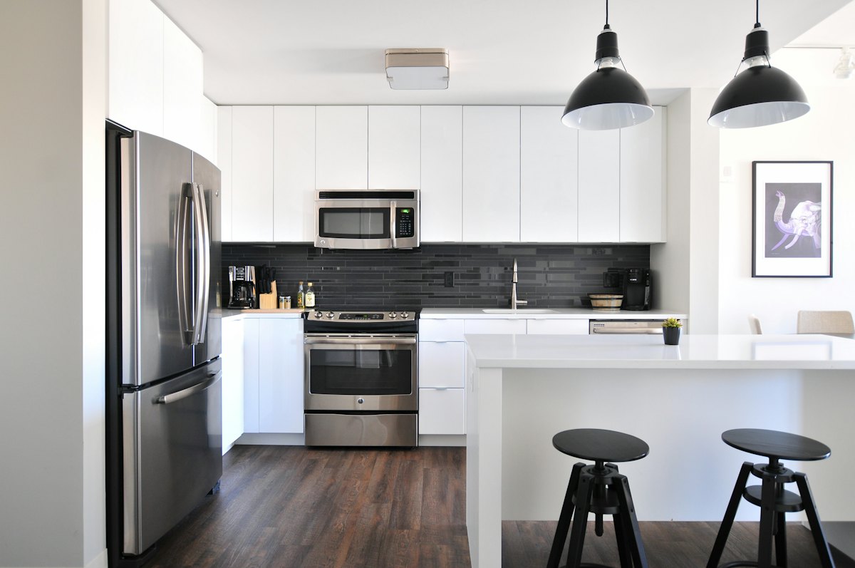 Bright kitchen with white units and an island
